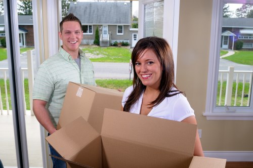 Professional removals team handling boxes and furniture in Surrey