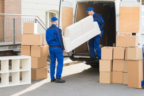 Local house movers preparing items for transport in Surrey