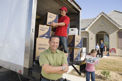 Careful loading of boxes and furniture into a van in Surrey