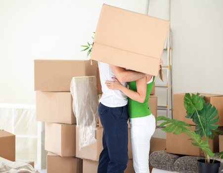 Packed boxes and wrapped furniture ready for transport