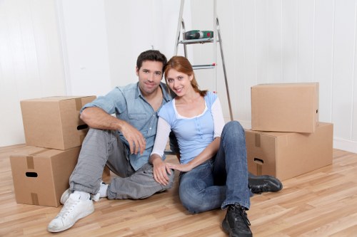 Professional movers loading furniture for a Surrey customer
