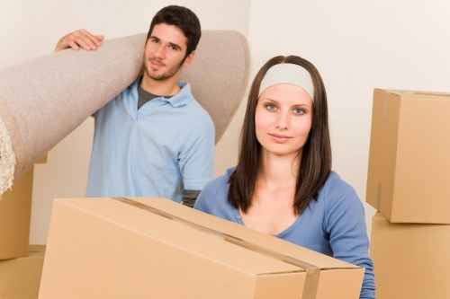 Business relocation crew handling furniture and boxes in Surrey