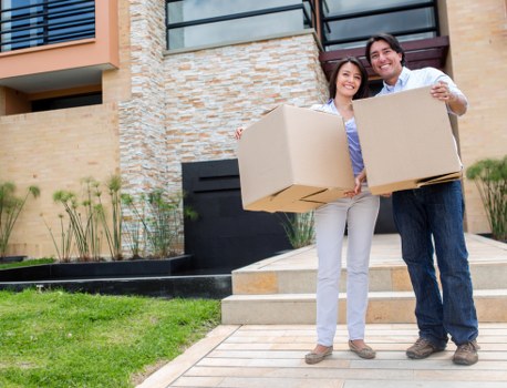 Unpacking boxes in a Surrey property after a move